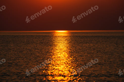 Preview: Dramatic Red Orange Colored Sunset Over The Calm Sea At Summer With Sun Way Of Reflections In Water