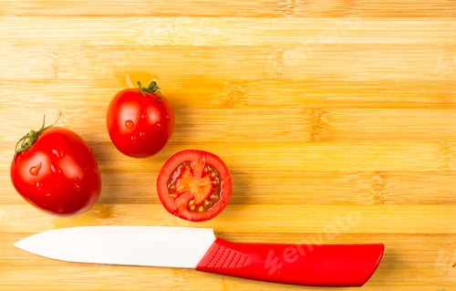 Preview: Still Life - Ripe Small Tomatoes And Knife On Wooden Background