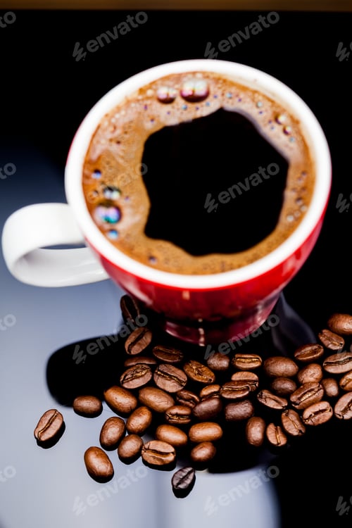 Preview: Red Cup Of Coffee With Coffee Beans And Dark Background