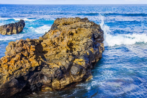 Preview: The Picturesque Rock At The Coast Of The Atlantic Ocean Is Washed By Waves