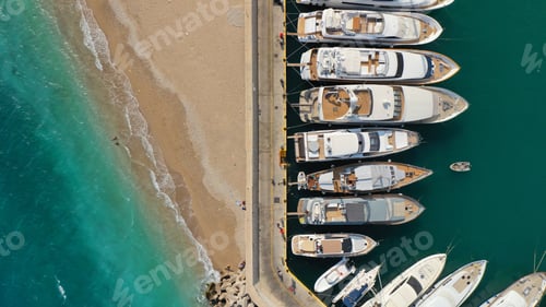 Preview: Aerial Top View Photo Of Luxury Yachts Docked In Marina Zeas And Turquoise Sandy Beach Of Peiraiki