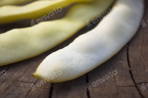 Preview: Large Pods Of White Beans On Old Wooden Background
