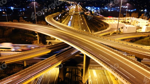 Preview: Aerial Drone Slow Shutter Night Shot Of Urban Elevated Toll Ring Road Junction And Interchange