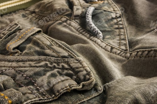 Preview: Clothing Items Stonewashed Cotton Fabric Texture With Seams, Clasps, Buttons And Rivets, Macro