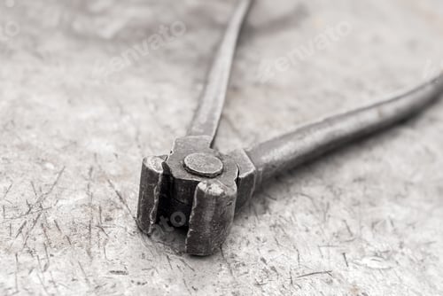 Preview: Old Pincers Lie On A Rusty Shabby Metal Surface