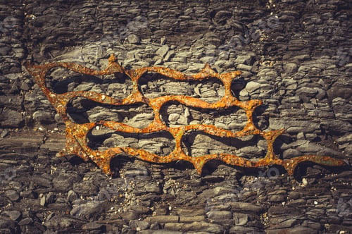 Preview: Very Rusty Metal On A Gray Cracked Rock