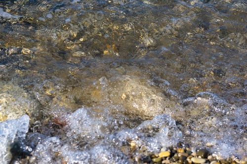 Preview: Sea Pebble Beach With Multicoloured Stones, Transparent Waves With Foam, On A Warm Summer Day