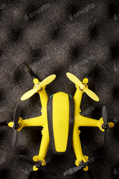 Preview: Yellow Drone On A Foam Table.