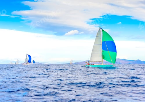 Preview: Sailing Boat With A Green - Blue Spinnaker During A Regatta Out Of Poros Island In Greece