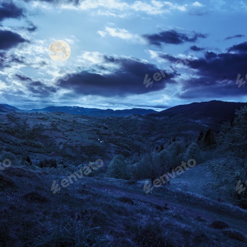 Preview: Green Fields In The Mountains Near Native Village Under A Blue Summer Sky At Night In Full Moon