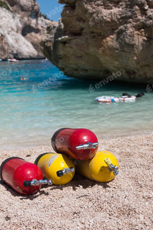 Preview: Colorful Scuba Oxygen Tanks For Divers On A Beach