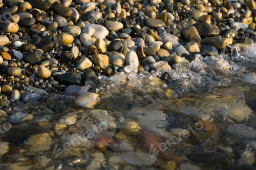 Preview: Pebble Stones On The Sea Beach, The Rolling Waves Of The Sea With Foam