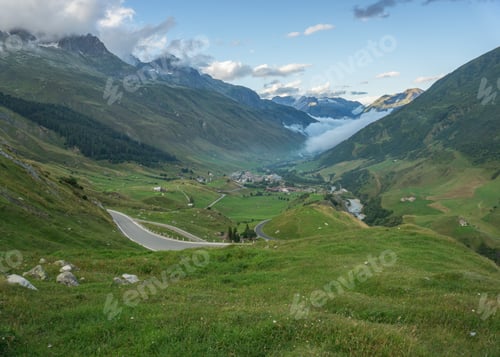 Preview: Road To Furka Mountain Pass In Switzerland Just After The Storm. Foggy And Cloudy Conditions With