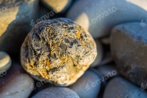 Preview: Boulders And Colorful Pebbles On The Beach