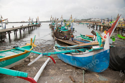 Preview: Brightly Colored And Traditional Fishing Boats Moored In An Indonesian Port, Sailors And Workmen