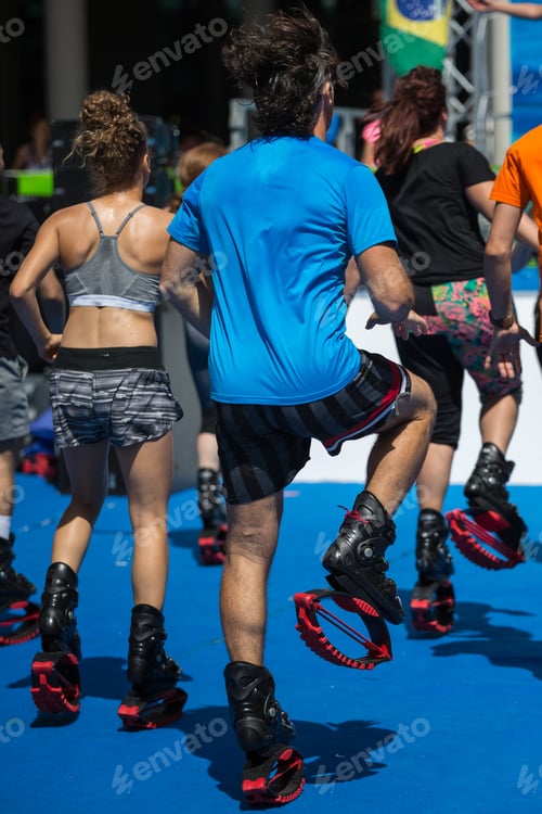 Preview: People In The Gym Doing Fitness Exercises With Special Elastic And Jumping Boots.