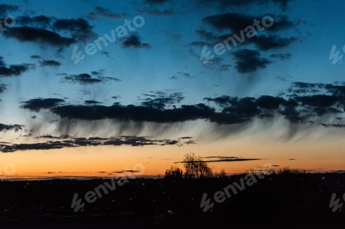 Preview: Sunset Over The City With Dramatic Colorful Sky And Tree Silhouettes