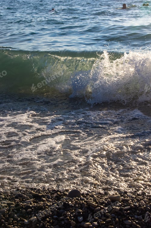 Preview: Sea Pebble Beach With Multicoloured Stones, Transparent Waves With Foam, On A Warm Evening