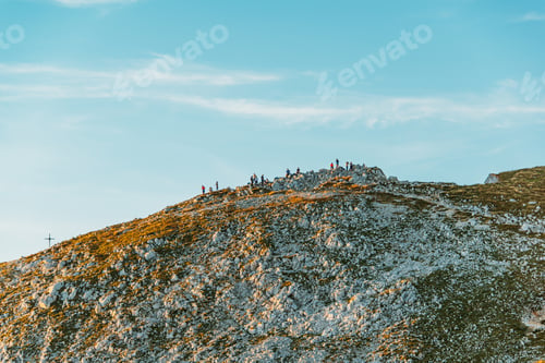 Preview: Hikers Observing The Sunset On Top Of The Mountain
