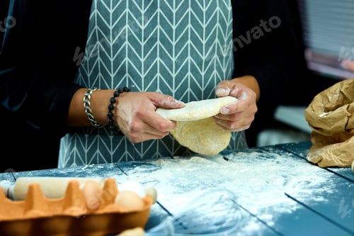 Preview: Man Forming The Dough On A Floured Surface And Kneading It With His Hands. Hand Of Baker Kneading