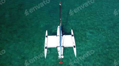 Preview: Aerial Top View Photo Of Small Catamaran Sail Boat Docked In Tropical Clear Emerald Sea