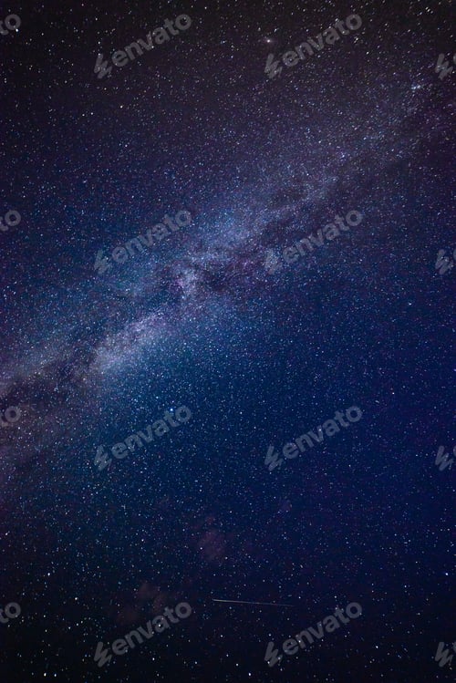 Preview: Colorful Milky Way Galaxy Seen In Night Sky Over Dark Trees On The Horizon