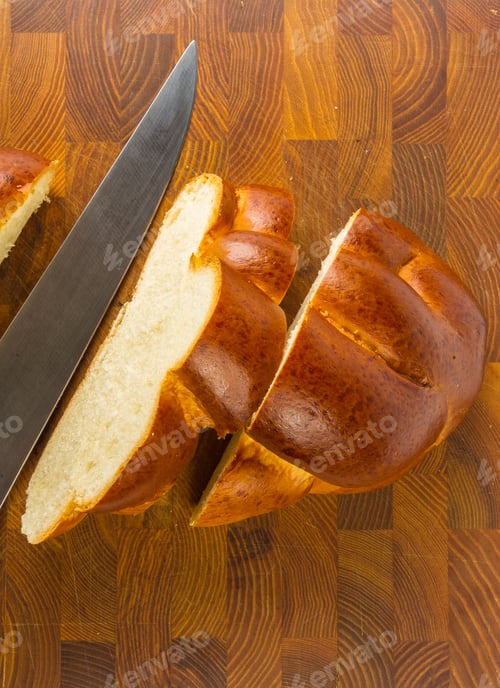Preview: Chunks Large Braided Loaf With Knife On Wooden Background
