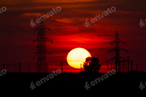 Preview: Beautiful, Dramatic, Colorful Clouds And Sky At Sunset. Electrical Wires And Stakes And Water