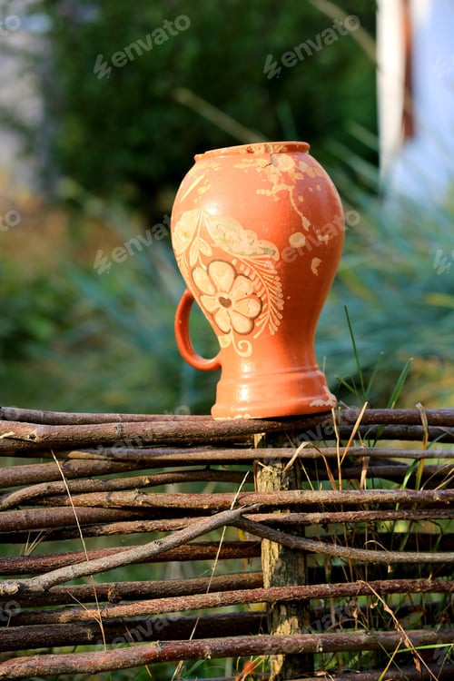 Preview: Traditional Ukrainian Clay Jug On Wooden Fence