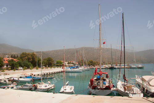 Preview: Boats And Dinghy Floating In The Sea Of A Mediterranean Port Or Marina