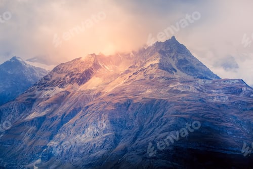 Preview: Swiss Alps Mountain Peaks Dramatic Sunset View, Cloudy Sky In Switzerland
