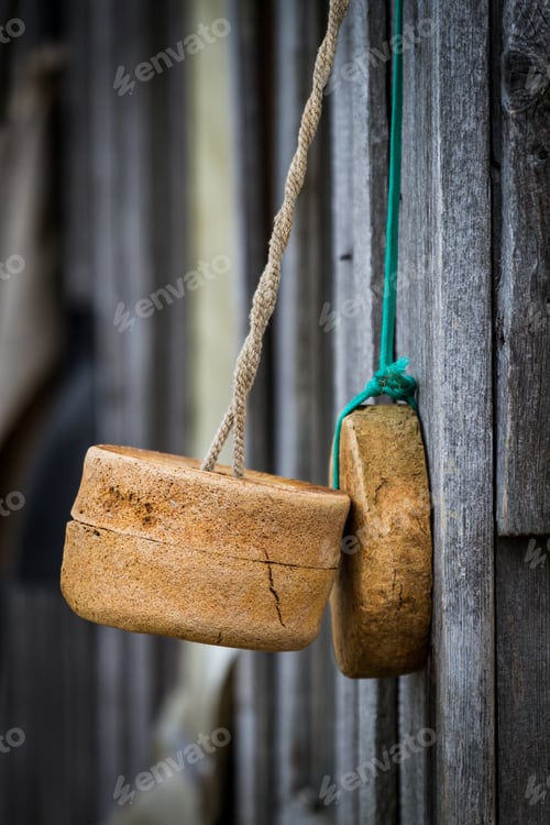Preview: Wooden Buoys and Ropes Hanging on Wood Wall