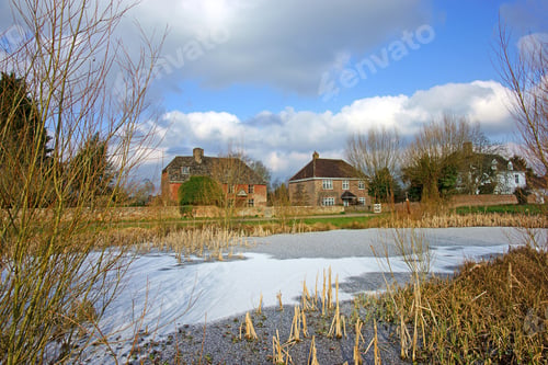 Preview: The Picturesque Village Of Frampton On Severn Looking Across One Of The Frozen Duck Ponds Enjoying