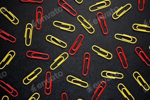 Preview: Paperclips Group On A Black Table.