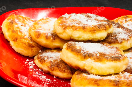 Preview: Red Plate Of Pancakes In Powdered Sugar On Black Background