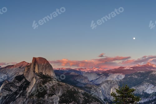 Preview: A Panoramic View Of Half Dome And Yosemite Valley. Golden Light From The Sunset Is Cast Upon The
