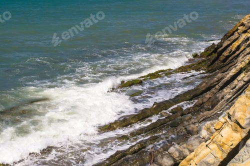 Preview: Rocky Sea Shore With Pebble Beach, Transparent Waves With Foam, On A Warm Summer Day