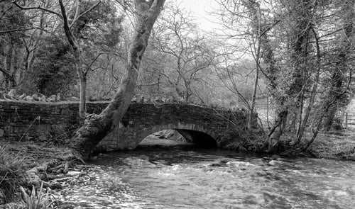 Preview: An Ancient Bridge Spanning The Mells River In Somerset, England. Photographed In Monochrome.