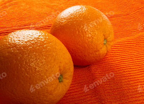 Preview: Two Orange On The Textile Orange Background