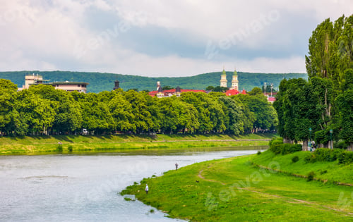 Preview: Part Of The Linden Alley On The Embankment Of River Uzh. Beautiful Sunny Summer Day In Uzhgorod