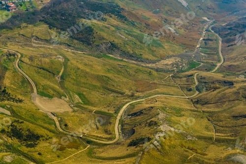 Preview: Aerial View Of A Winding Mountain Road