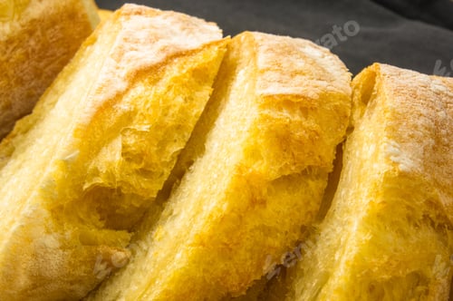 Preview: Fresh Sliced Loaf Of White Wheat Bread On Wooden Background