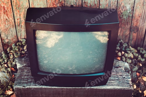 Preview: Old Analog Television Set On The Weathered Wooden Planks Background
