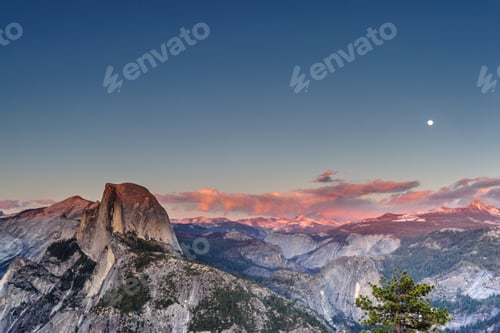 Preview: A Panoramic View Of Half Dome And Yosemite Valley. Golden Light From The Sunset Is Cast Upon The