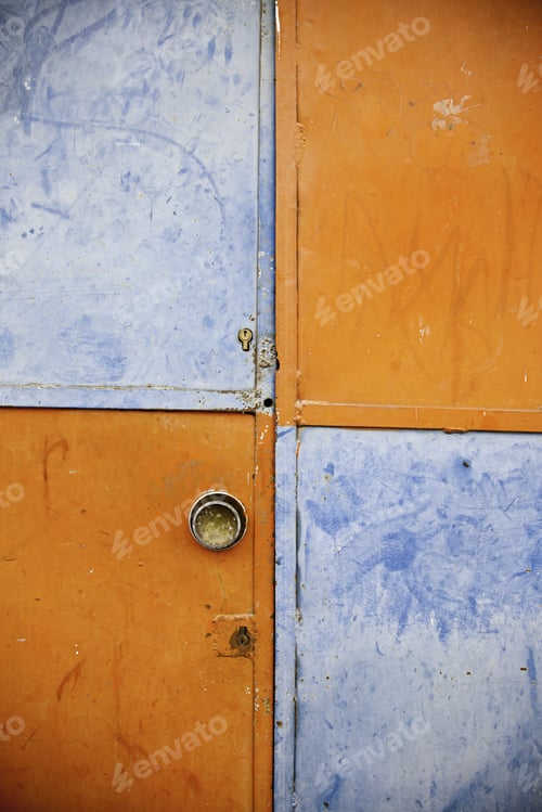 Preview: Orange And Blue Closed Door, Detail Of A Decorated Door In The City, Loneliness And Abandonment