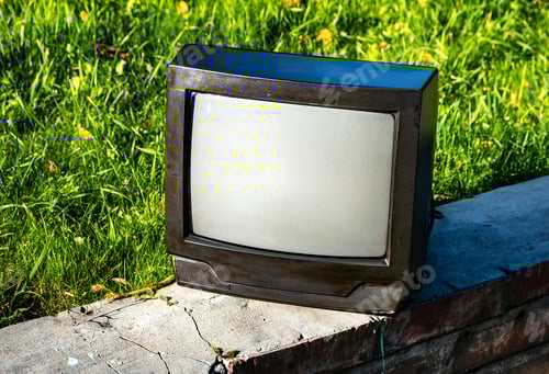 Preview: Old Analog Television Set On The Grass Background Outdoor