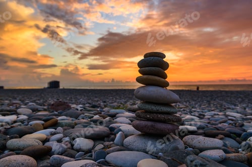 Preview: Stones Pyramid On Sand Symbolizing Zen, Harmony, Balance. Black Sea At Sunset In The Background.