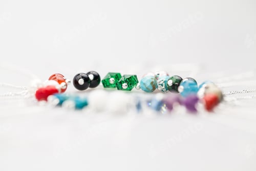 Preview: Silver Jewels With Colorful Precious Stones And Light Grey Background
