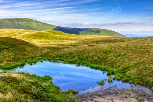 Preview: Summer Landscape In Mountains With Small Swamp On Hill Side