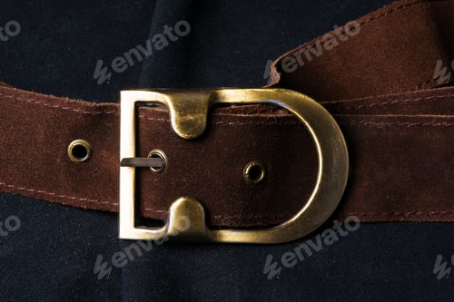 Preview: Closeup Of The Brown Suede Strap With Yellow Metal Buckle